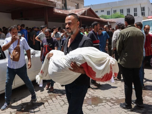 a palestinian man carries the body of a person killed during a reported israeli strike on a humanitarian aid distribution warehouse in the sabra neighbourhood in gaza city in the central gaza strip on the grounds of al ahli arab hospital also known as the baptist hospital on june 30 2025 photo afp a palestinian man carries the body of a person killed during a reported israeli strike on a humanitarian aid distribution warehouse in the sabra neighbourhood in gaza city in the central gaza strip on the grounds of al ahli arab hospital also known as the baptist hospital on june 30 2025 photo afp