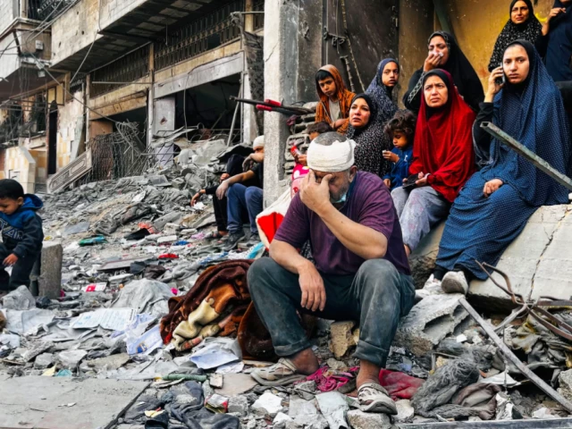 an injured man sits on the rubble of a building destroyed by an israeli strike in beit lahia gaza photo afp an injured man sits on the rubble of a building destroyed by an israeli strike in beit lahia gaza photo afp