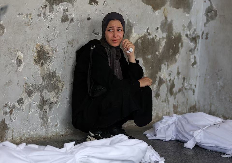 A mourner attends the funeral of Palestinians killed in Israeli strikes, according to medics, at Al-Ahli Arab Hospital in Gaza City August 12, 2025. PHOTO: REUTERS
