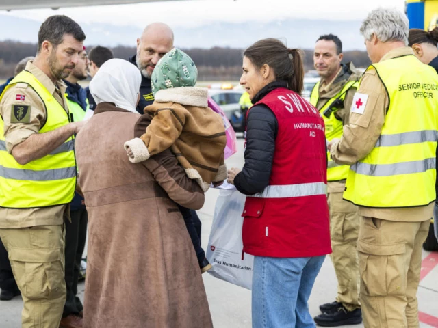 a woman and her baby arrive in geneva among 13 children and 51 family members moved from gaza under medical evacuations photo afp