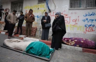 mourners gather next to bodies as they attend the funeral of palestinians who according to medics were killed after a wall collapsed at a war damaged building on a windy winter day at al shifa hospital in gaza city january 13 2026 photo reuters