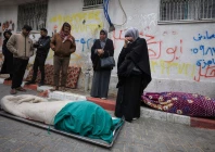 mourners gather next to bodies as they attend the funeral of palestinians who according to medics were killed after a wall collapsed at a war damaged building on a windy winter day at al shifa hospital in gaza city january 13 2026 photo reuters