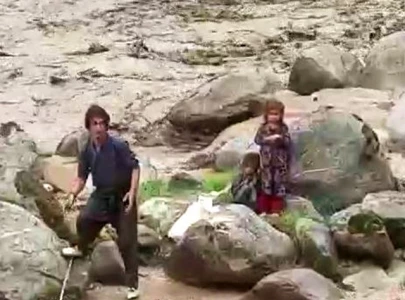 watch two youths brave gushing flood waters to save two minor girls in g b