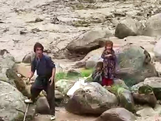 watch two youths brave gushing flood waters to save two minor girls in g b watch two youths brave gushing flood waters to save two minor girls in g b