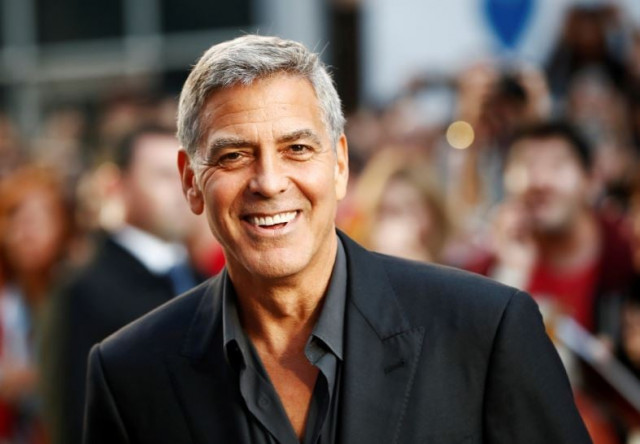george clooney assists fallen photographer at venice film festival premiere george clooney assists fallen photographer at venice film festival premiere