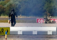 a police officer in protective clothing walks next to an explosive disarming robot eod at leipzig halle airport in schkeuditz germany august 5 2026 after the police said explosives experts examined a drone found near a runway and after a dhl cargo aircraft hit an unknown object as it was climbing away from the airport overnight prompting an unscheduled landing in hanover according to a source familiar with the incident reuters