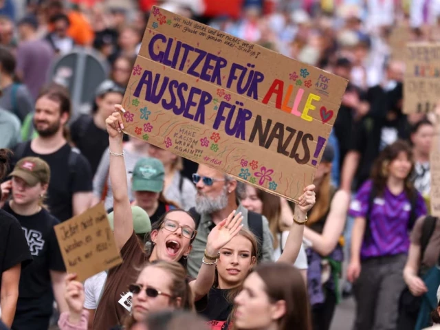 people hold a sign that reads glitter for everyone except for nazis during a protest against a two day party convention of germany s far right alternative for germany afd party in erfurt germany july 4 2026 reuters people hold a sign that reads glitter for everyone except for nazis during a protest against a two day party convention of germany s far right alternative for germany afd party in erfurt germany july 4 2026 reuters