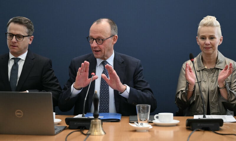 the secretary general of germany s christian democratic union cdu carsten linnemann the leader of germany s christian democratic union cdu and the party s top candidate for chancellor friedrich merz c and cdu board member silvia breher react prior the cdu s leadership meeting at the party s headquarters in berlin on february 24 photo afp