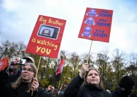 people carry placards featuring images of german chancellor friedrich merz during a nationwide protest by campaign group gen z regelt gen z takes charge against underfunding of schools cuts to education social services culture and healthcare rising living costs and military conscription in berlin germany october 31 2026 reuters