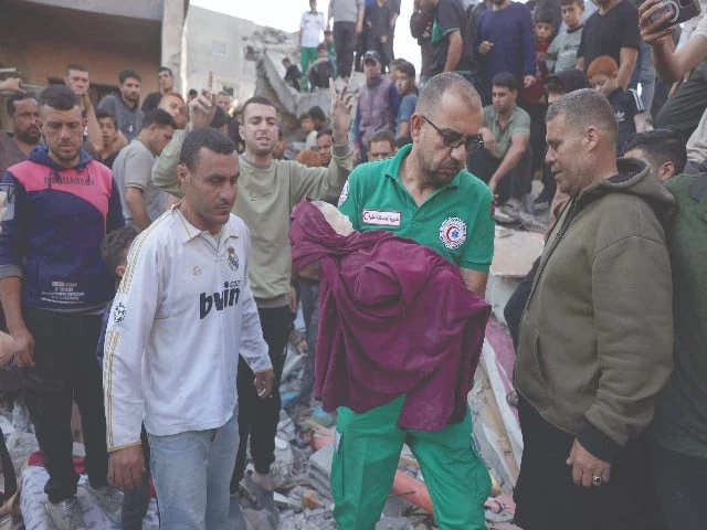 a rescuer carries the body of a baby dug out from under the rubble following an israeli strike that hit the home of a palestinian family in jabalia in gaza photo afp a rescuer carries the body of a baby dug out from under the rubble following an israeli strike that hit the home of a palestinian family in jabalia in gaza photo afp