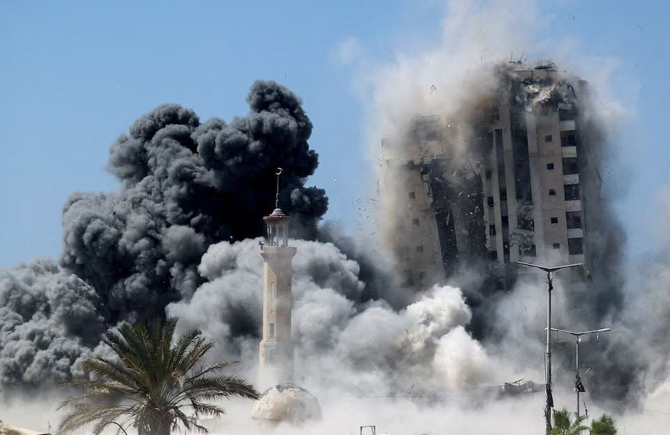 Smoke rises as the 15-storey Mushtaha Tower collapses after being hit by an Israeli air strike, in Gaza City, September 5, 2025. PHOTO: Reuters