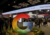visitors walk near a logo of google at bharat mandapam one of the venues for ai impact summit in new delhi india february 17 2026 reuters
