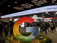 visitors walk near a logo of google at bharat mandapam one of the venues for ai impact summit in new delhi india february 17 2026 reuters