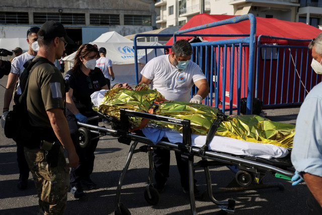 rescuers transfer a migrant to an ambulance following a rescue operation after their boat capsized at open sea in kalamata greece june 14 2023 photo reuters rescuers transfer a migrant to an ambulance following a rescue operation after their boat capsized at open sea in kalamata greece june 14 2023 photo reuters