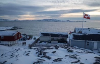 a greenland flag flies as people walk on the day of a meeting between top us officials and the foreign ministers of denmark and greenland in nuuk greenland january 14 2026 photo reuters