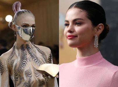 grimes backs selena gomez amid online speculation over in the dark video appearance