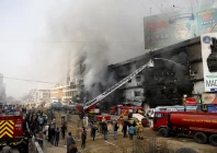 smoke rises as firefighters spray water to extinguish a massive fire that broke out in the gul plaza shopping centre building in karachi pakistan january 18 2026 photo reuters