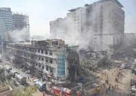 rescue workers search amid the debris using excavators after a massive fire at a shopping mall in karachi photo afp