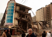muhammad imran 56 a crockery shop owner who survived looks on following a massive fire that broke out in the gul plaza shopping mall in karachi on january 23 photo reuters