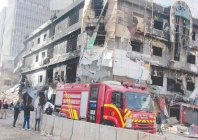 on the seventh day after the fire rescue workers perform search operations amid the debris photo nni