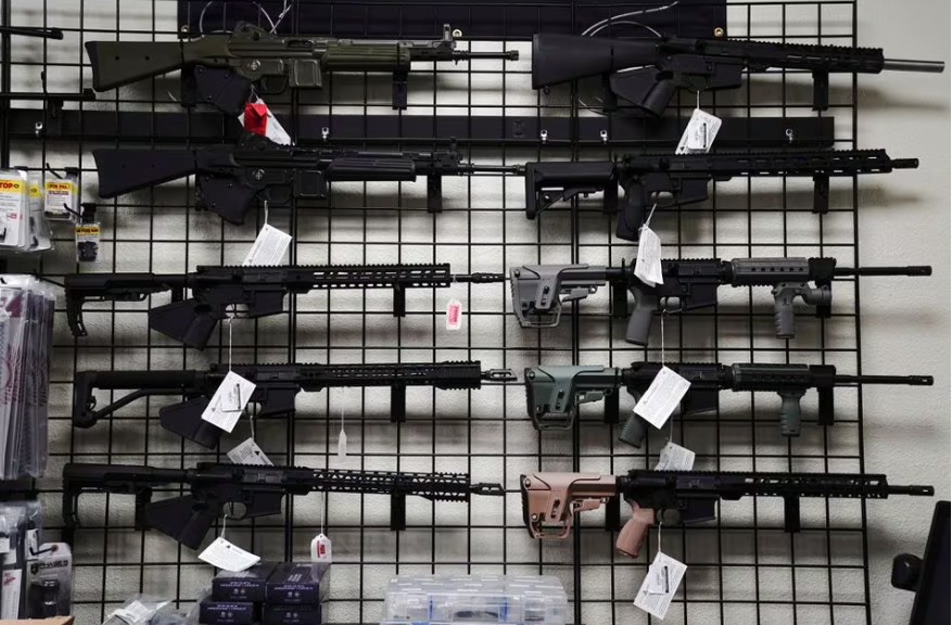 ar 15 style rifles are displayed for sale at firearms unknown a gun store in oceanside california u s april 12 2021 reuters bing guan file photo