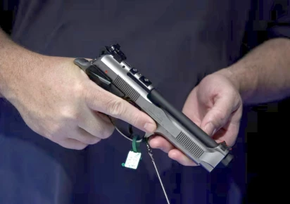 an attendee holds a handgun on display at the national rifle association nra annual convention in houston texas u s may 29 2022 reuters