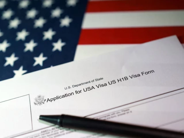 a us flag and a us h 1b visa application form are seen in this illustration taken september 22 2025 photo reuters a us flag and a us h 1b visa application form are seen in this illustration taken september 22 2025 photo reuters