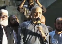 ji chief hafiz naeem addressing sit in at rawalpindi s liaquat bagh on friday screengrab