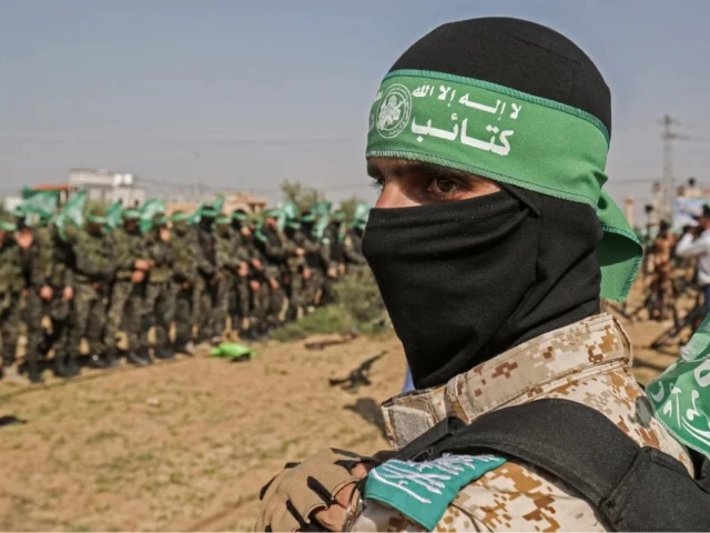 fighters from the izzedine al qassam brigades the armed wing of the hamas movement take part in an anti israel military show parade in khan younis in the southern gaza strip photo afp fighters from the izzedine al qassam brigades the armed wing of the hamas movement take part in an anti israel military show parade in khan younis in the southern gaza strip photo afp