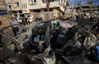 palestinians inspect the site of an israeli strike on a car in gaza city december 13 2025 photo reuters