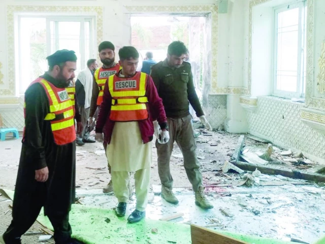 rescuers and police officials collect evidence after a suicide blast at dar ul uloom haqqania in akora khattak photo express rescuers and police officials collect evidence after a suicide blast at dar ul uloom haqqania in akora khattak photo express