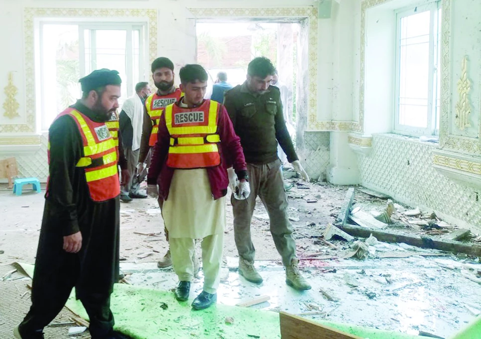 rescuers and police officials collect evidence after a suicide blast at dar ul uloom haqqania in akora khattak photo express rescuers and police officials collect evidence after a suicide blast at dar ul uloom haqqania in akora khattak photo express