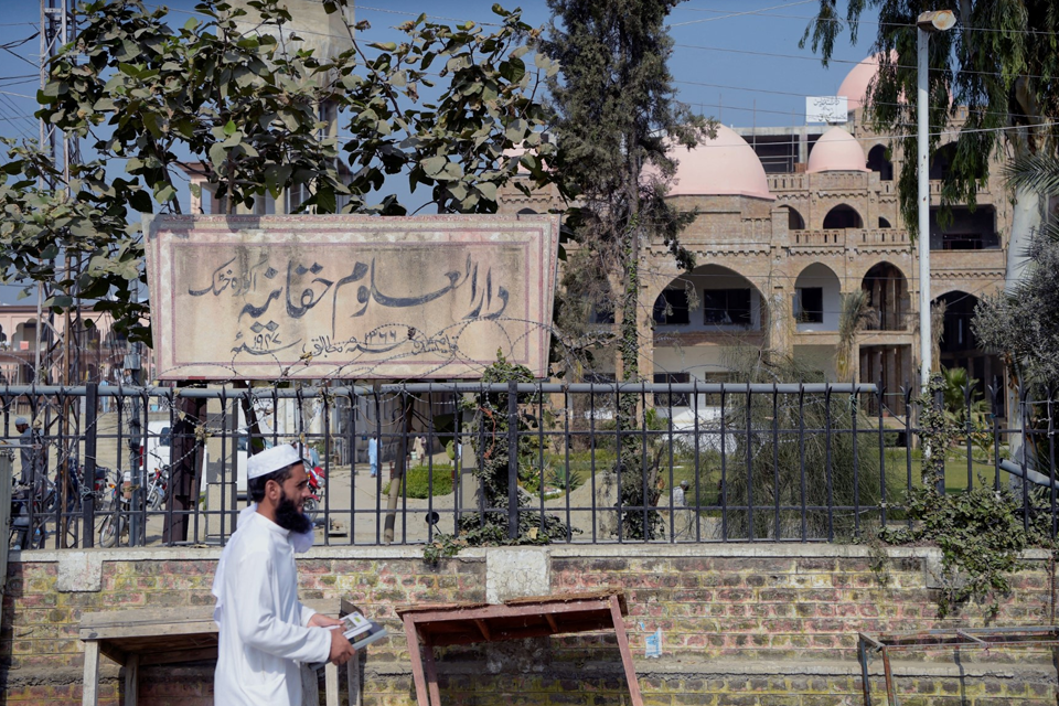 A student from Darul Uloom Haqqania seminary in Akora Khattak is seen leaving the institution on October 19, 2020. Photo: AFP