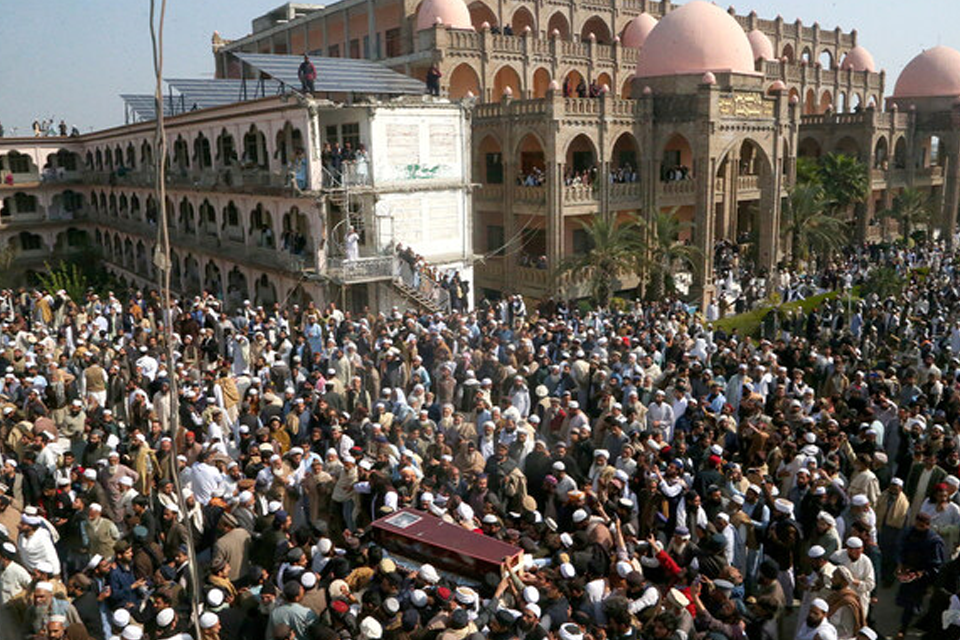 A view of people gathering as the funeral of JUI-S chief Maulana Hamidul Haq Haqqani is held at Darul Uloom Haqqania. Photo courtesy: AP