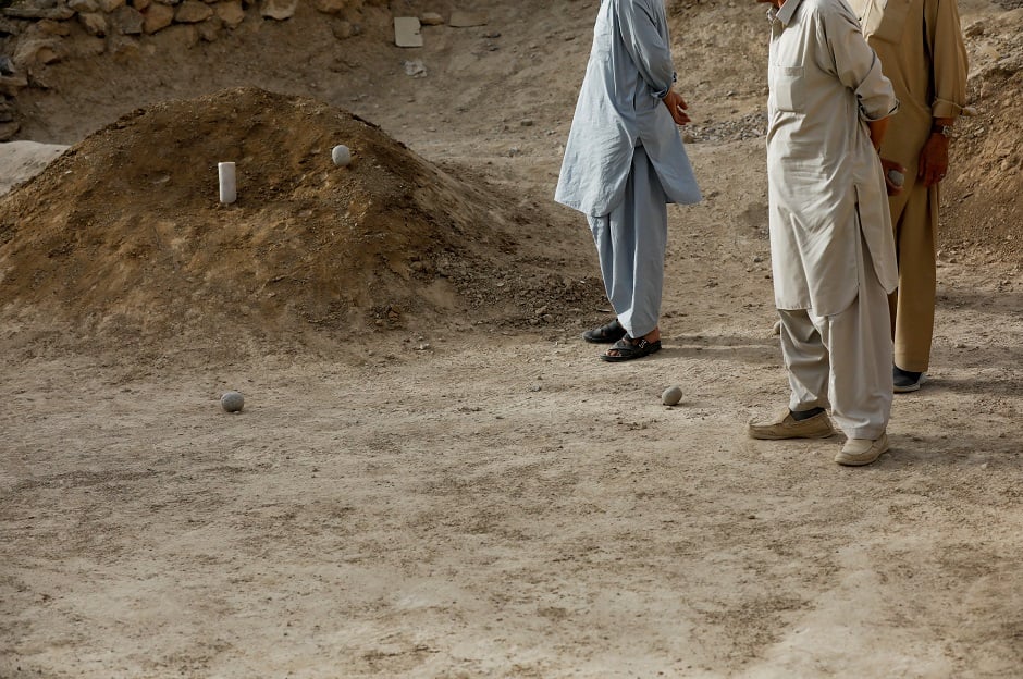 People from ethnic Hazara community sand as they play a game Sang Girag (stone throwing) PHOTO: Reuters