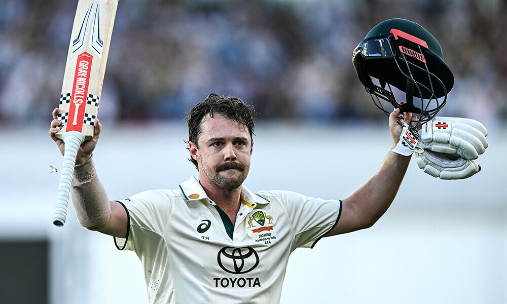 australia s travis head celebrates after scoring a century on the second day of the second cricket test match between australia and india at the adelaide oval photo afp