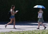 people use umbrellas and fans to protect themselves from high temperatures in munich germany june 26 2026 reuters