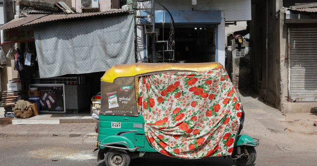 an autorickshaw covered with a cloth is seen on the street during a heat wave in ahmedabad india may 30 2024 reuters amit dave an autorickshaw covered with a cloth is seen on the street during a heat wave in ahmedabad india may 30 2024 reuters amit dave