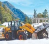 heavy machinery is being used to clear a road of snow in abbottabad photo ppi