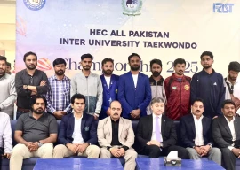 participants of the all pakistan inter university taekwondo championship 2025 pose with chief guests photo organisers