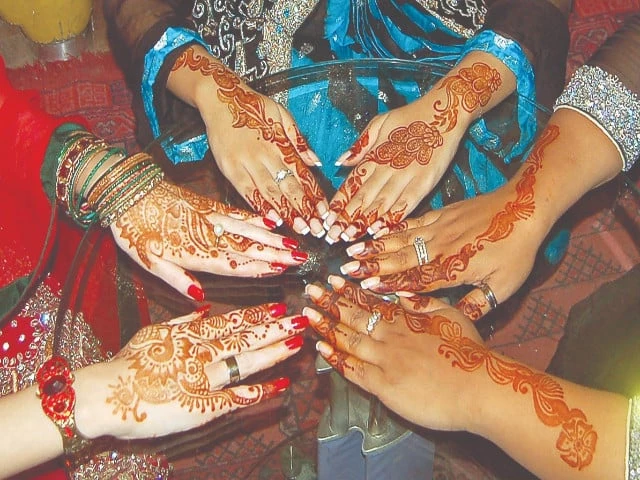 women proudly display their freshly applied mehndi henna showcasing intricate designs on their hands in preparation for the eidul fitr festivities in the federal capital photo inp women proudly display their freshly applied mehndi henna showcasing intricate designs on their hands in preparation for the eidul fitr festivities in the federal capital photo inp