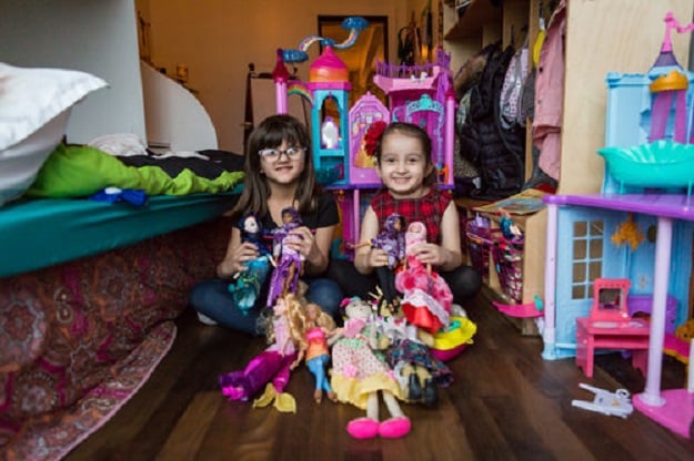 Salma Bokhari, age 5, and Grace Fetterman, also age 5, play with Graces dolls while their mothers, Gisele Fetterman and Safaa Bokhari, met to discuss plans for their new initiative, Hello Hijab. PHOTO: HELLO HIJAB