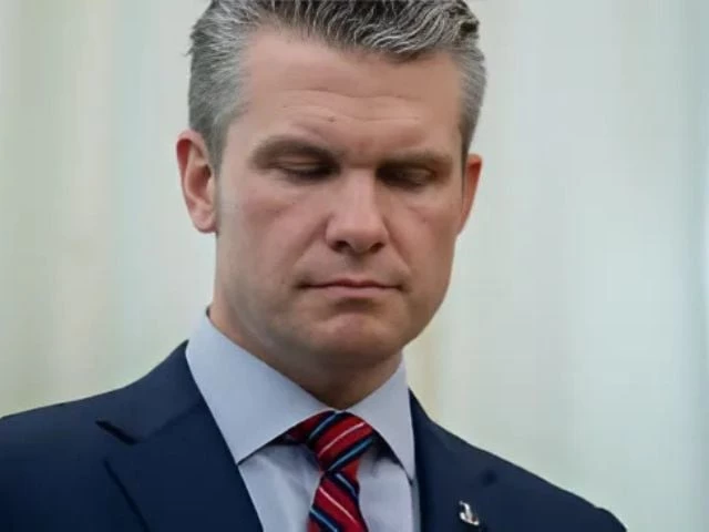 u s defense secretary pete hegseth closes his eyes as he stands by us president donald trump not pictures in the oval office at the white house in washington d c u s march 21 2025 photo reuters