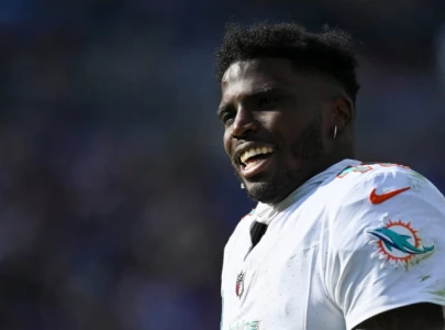 tyreek hill secures record breaking contract extension with dolphins