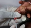 a nurse draws a blood sample from a child for an hiv test at a clinic in south africa photo reuters file