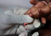 a nurse draws a blood sample from a child for an hiv test at a clinic in south africa photo reuters file