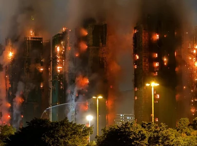 hong kong fire death toll rises to 65 as over 250 residents remain missing