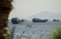 vessels sail through the strait of hormuz musandam oman may 22 2026 reuters