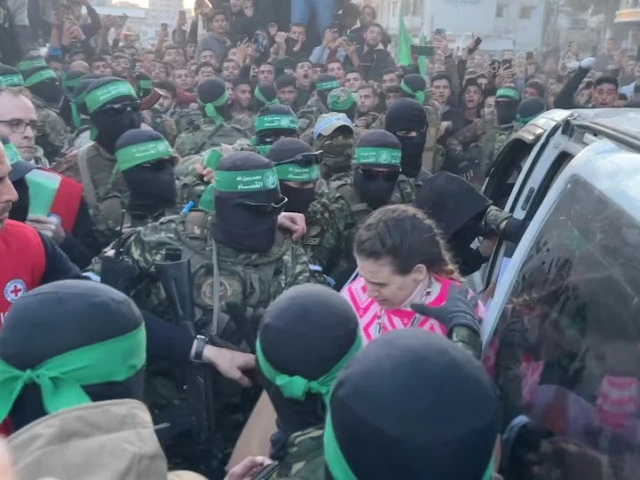 palestinian hamas militants hand over hostages gaza city january 19 2025 photo reuters palestinian hamas militants hand over hostages gaza city january 19 2025 photo reuters
