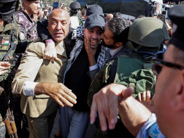 a freed palestinian prisoner is greeted after he was released from an israeli jail as part of a hostages prisoners swap and a ceasefire deal in gaza between hamas and israel in ramallah in the israeli occupied west bank october 13 2025 photo reuters